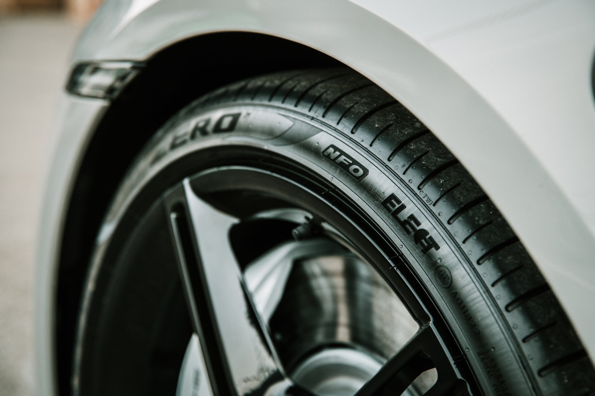 Close-up view of a Pirelli Elect tire designed specifically for electric vehicles, highlighting the unique tread pattern that reduces rolling resistance and road noise