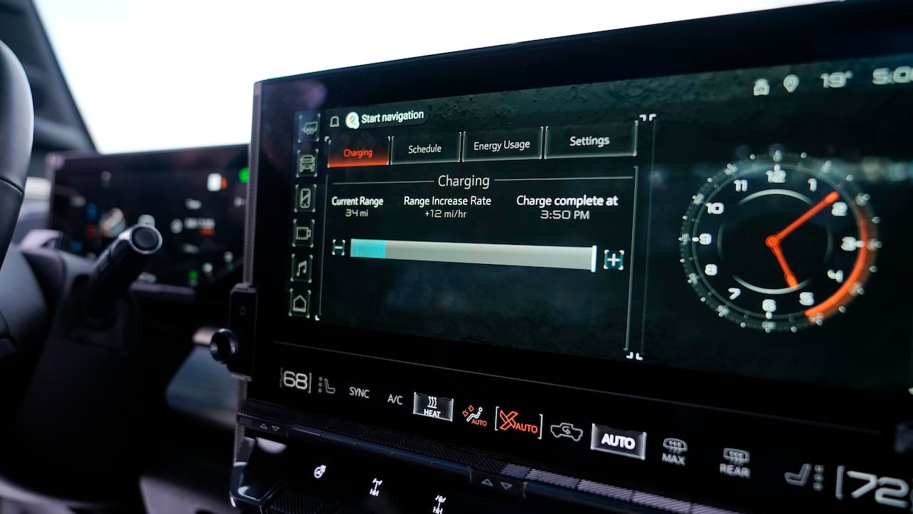 Electric vehicle dashboard screen showing reduced range and charging details during freezing winter conditions, a typical example of cold weather EV battery performance