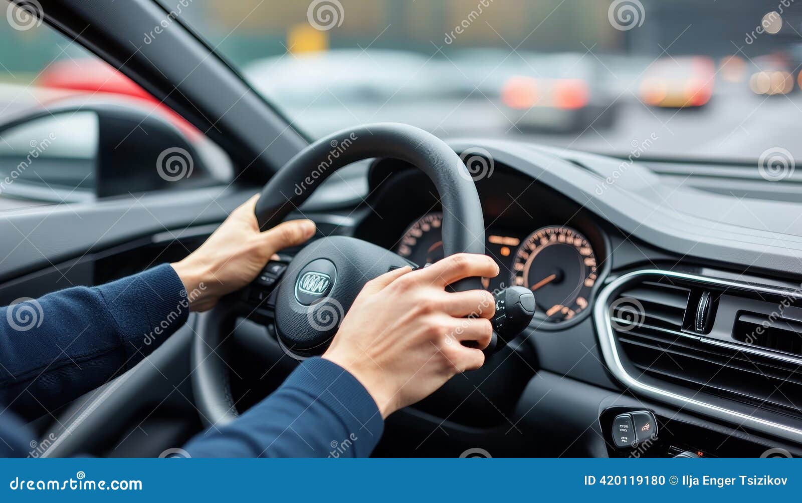 Driver with calm hands on the steering wheel enjoying a peaceful, quiet ride in an electric vehicle on a scenic route