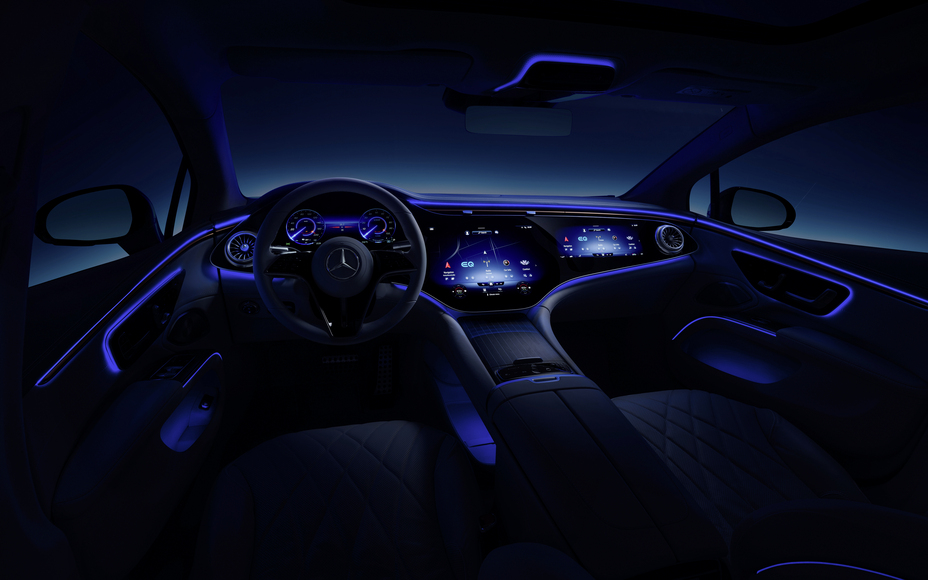 Inside a modern electric luxury SUV at night with ambient blue lighting and large digital displays glowing, comfortable driver view that highlights the refined interior of new electric cars in 2027